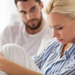 unhappy-couple-having-conflict-in-bed-at-home.jpg
