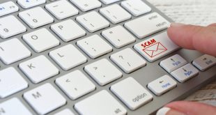 Online Email Scam concept computer keyboard with SCAM email icon symbol about to be opened, no logos